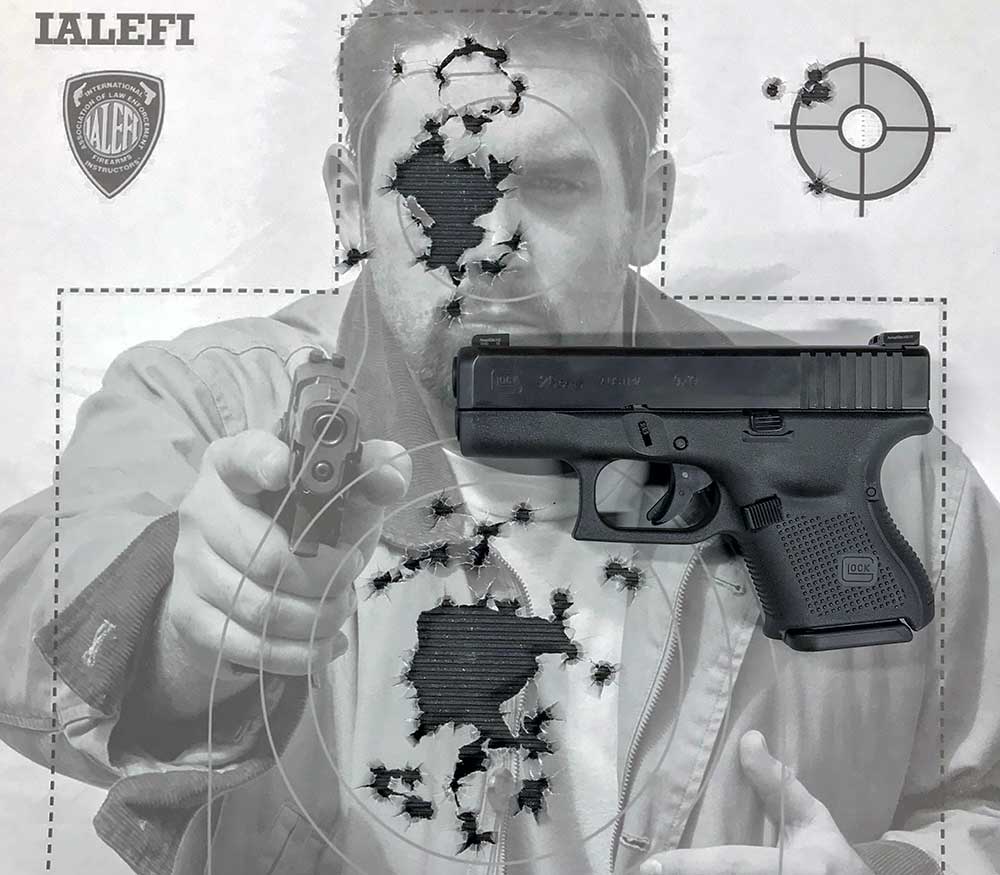 Glock 25 Gen 5 shown on target with bullet holes through it.