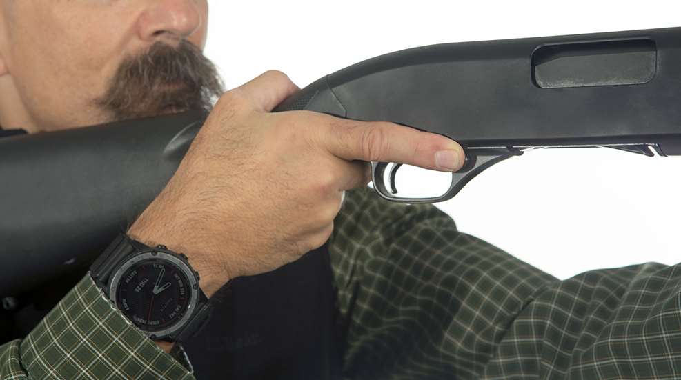 finger off trigger of shotgun