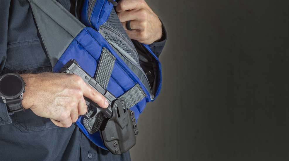 man wearing fanny pack with holster