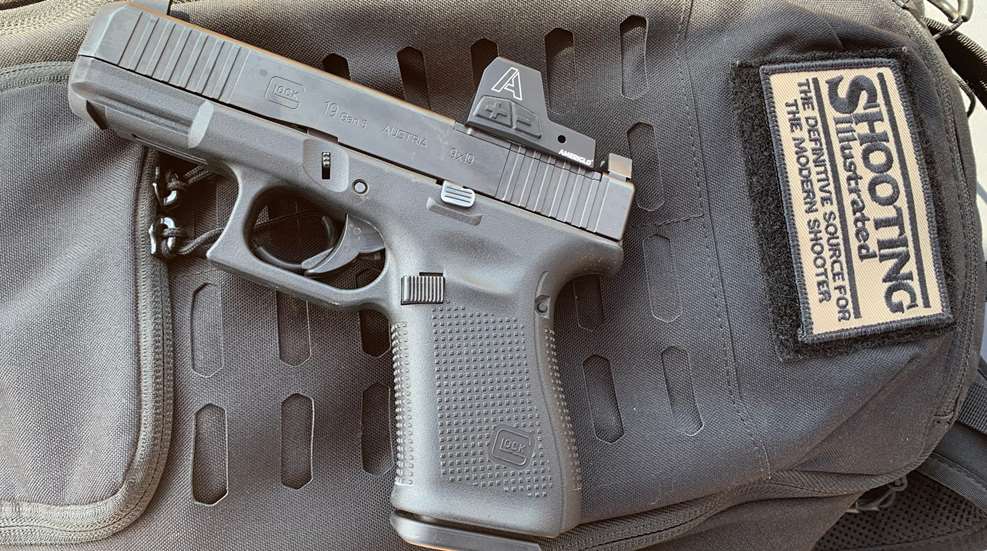 pistol with red dot facing left