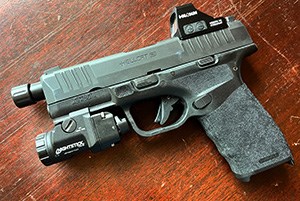 TCM-5B on a pistol