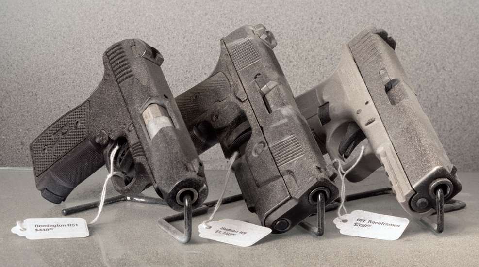 3 guns on a table