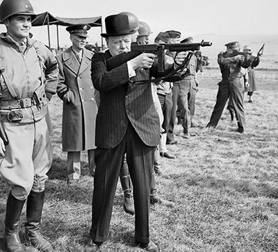 British Prime Minister Winston Churchill fires a Thompson