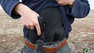 concealed handgun being drawn