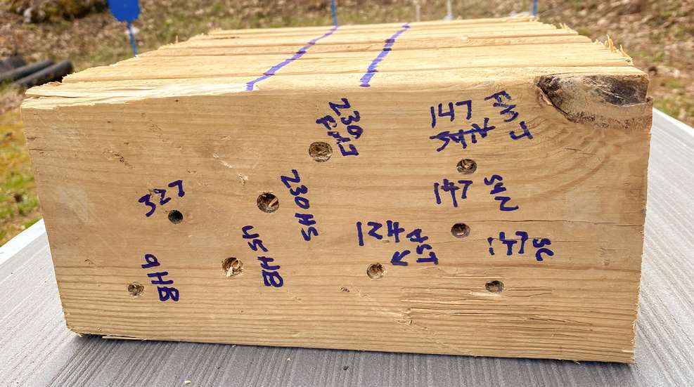 treated pine boards with bullet holes