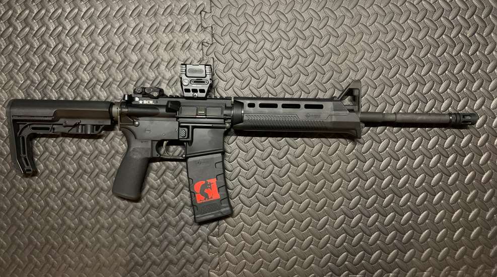 Rifle with red dot attached