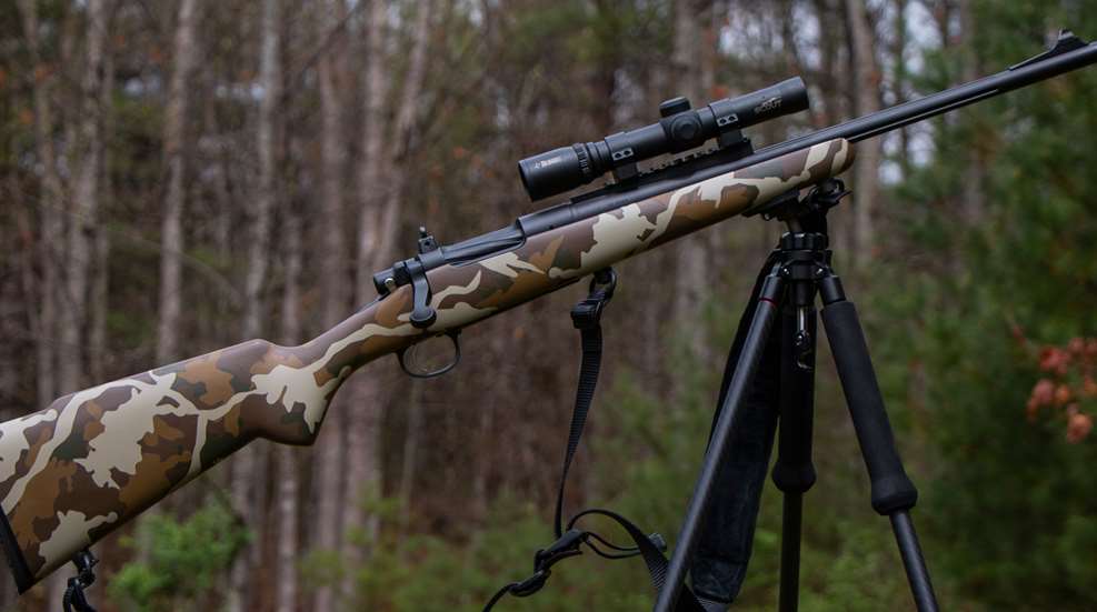 scout rifle on tripod