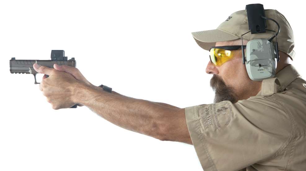 man shooting at range