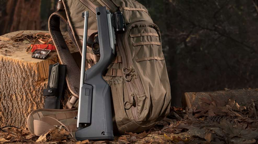 Ruger Takedown 22 in Magpul stock leaning against backpack
