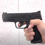I Carry 22 Spotlight SIG P322 pistol facing left