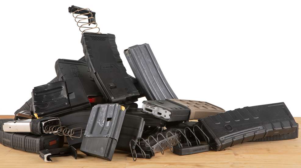 pile of firearm magazines