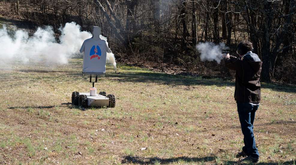 person shooting at moving target