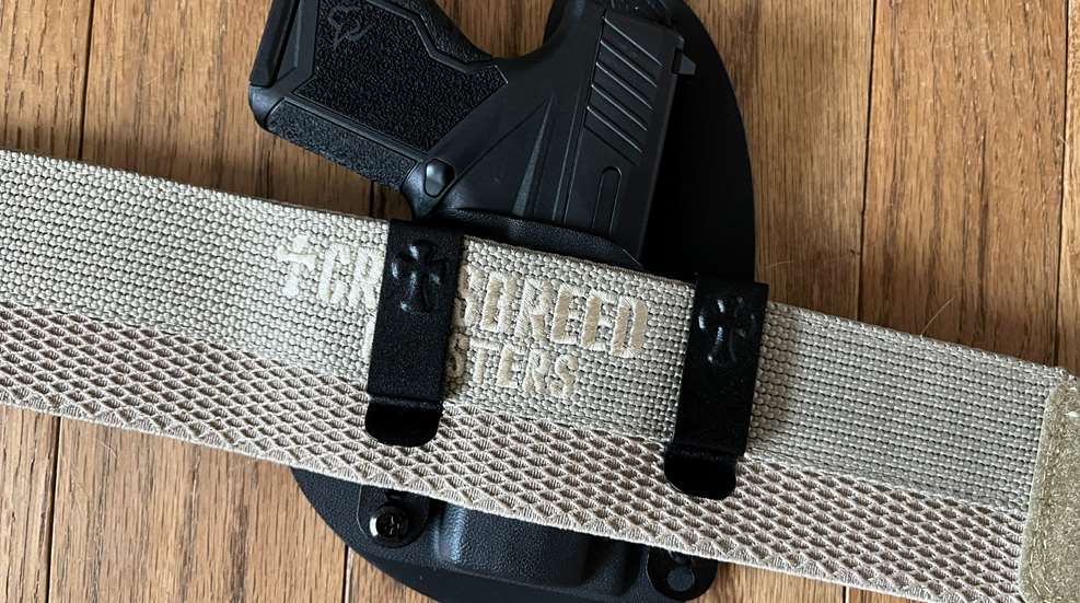 holster clipped to belt