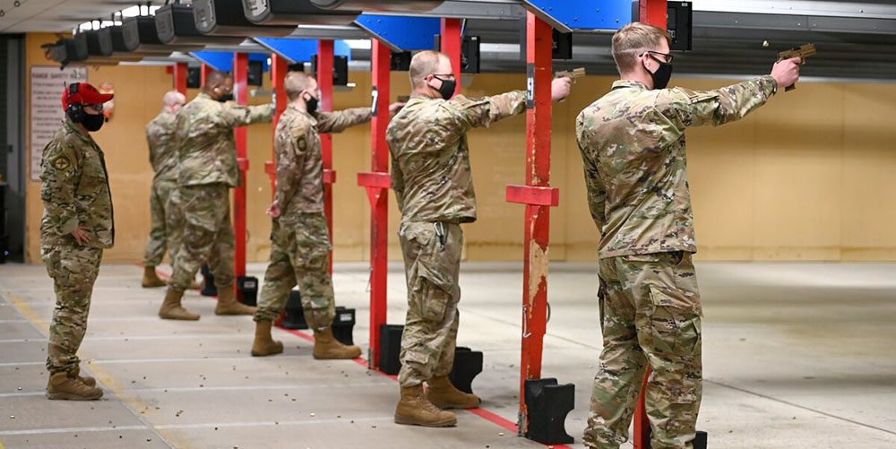 military personnel practicing at the range