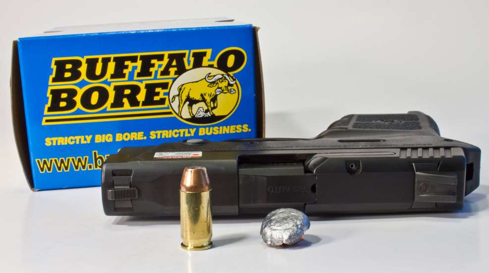 handgun next to bullet and recovered slug
