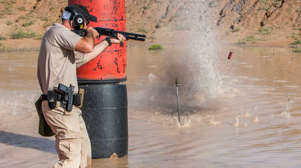 aiming a shotgun