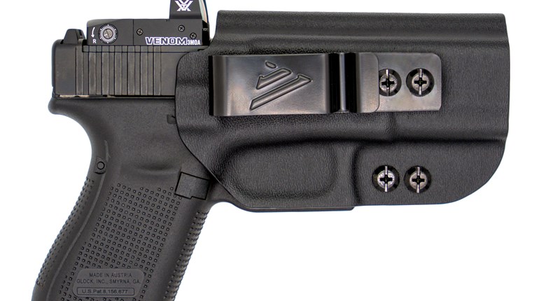 pistol with red dot in holster