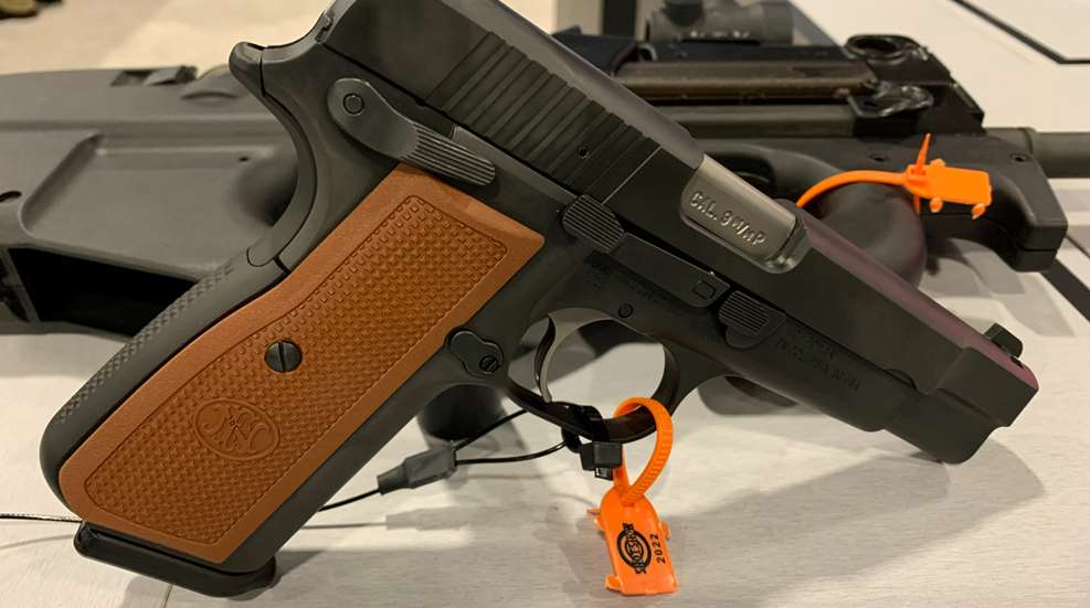 FN High Power pistol facing right