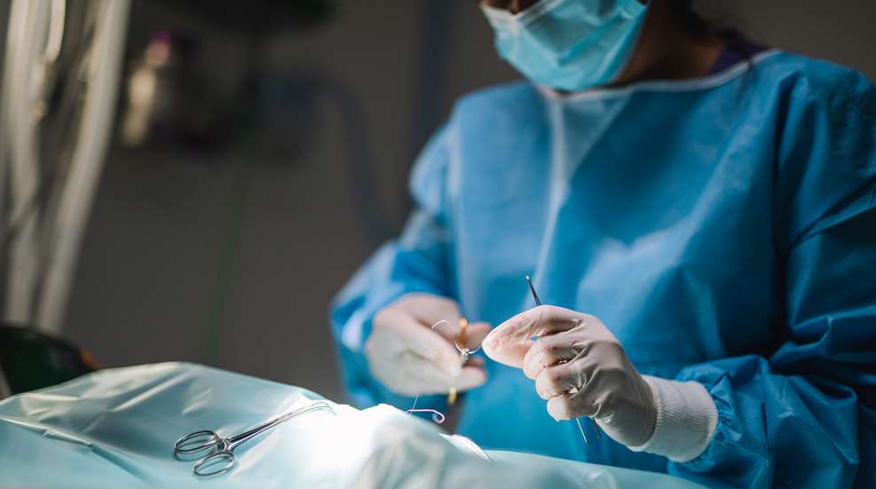 Surgeon working on patient