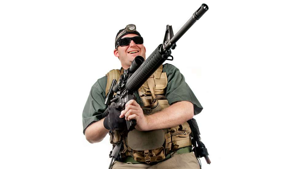 shooter in tactical gear with rifle